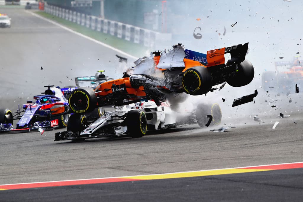 SPA, BELGIUM - AUGUST 26: Fernando Alonso of Spain driving the (14) McLaren F1 Team MCL33 Renault launches over the top of Charles Leclerc of Monaco driving the (16) Alfa Romeo Sauber F1 Team C37 Ferrari at the start during the Formula One Grand Prix of Belgium at Circuit de Spa-Francorchamps on August 26, 2018 in Spa, Belgium. (Photo by Mark Thompson/Getty Images)