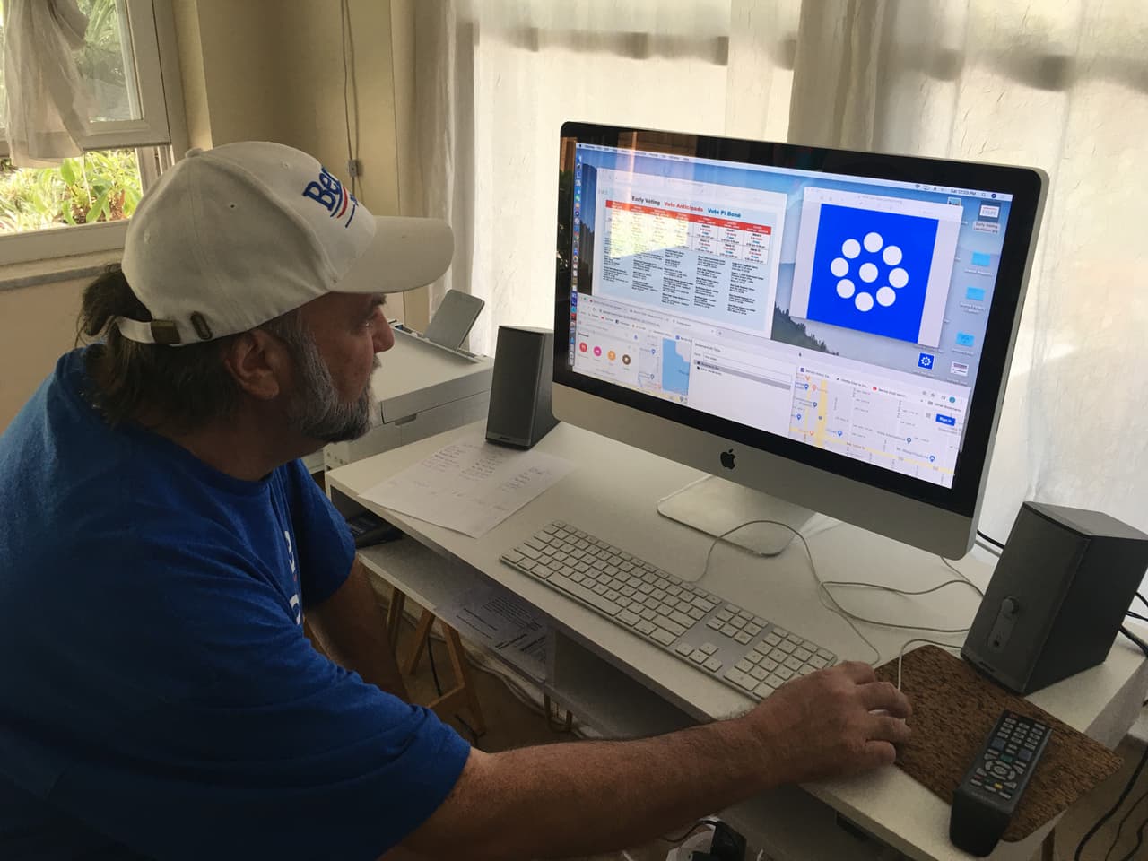 Sanders campaign 'captain' AJ Nicols enters volunteer details into the MiniVAN 8 canvassing app at his home in north Miami, dubbed the 'Bernie Barn.'