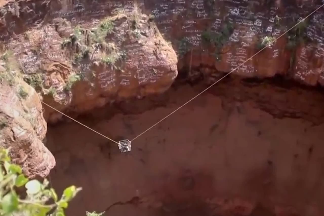 This screengrab from video, released by Yemeni Civil Defense Authority, shows rescuers removing the body of daredevil adventurer Al-Qaqa Ibn Antar on Saturday, June 13, 2026, after he had fallen into a volcanic crater in southern Yemen while climbing without safety equipment on Friday. (Yemeni Civil Defense Authority via AP)