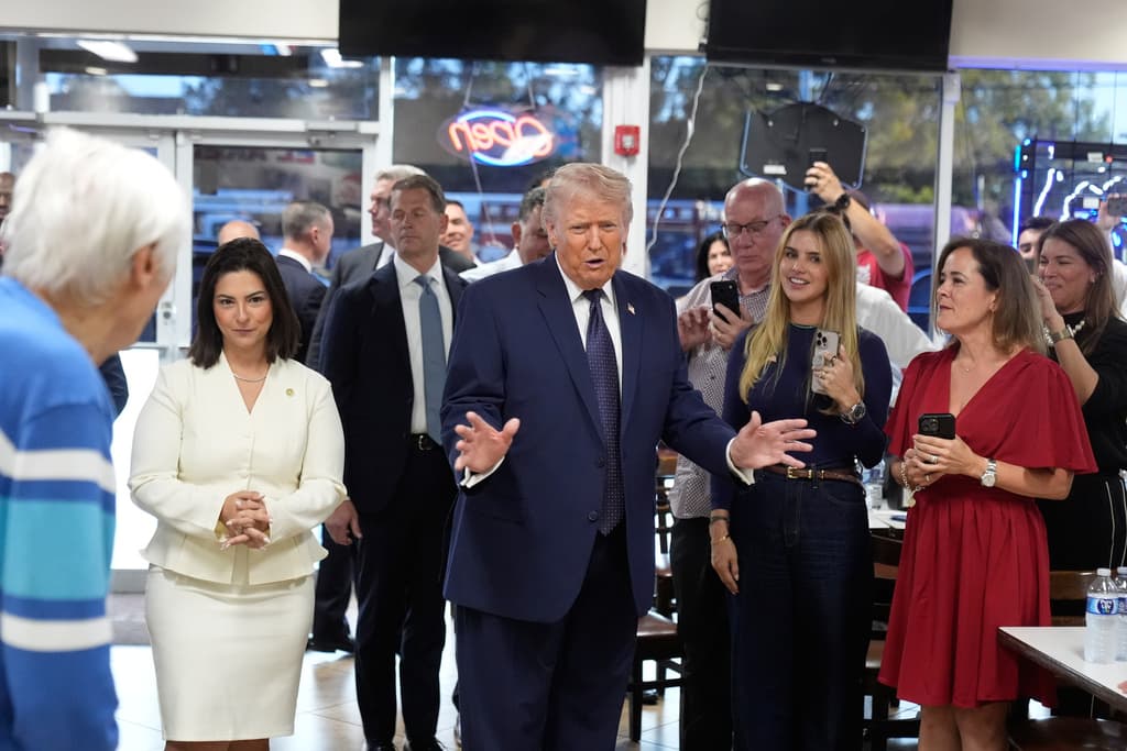 President Donald Trump speaks as he visits Venezuelan restaurant El Arepazo, Monday, March 9, 2026, in Doral, Fla. (AP Photo/Mark Schiefelbein)