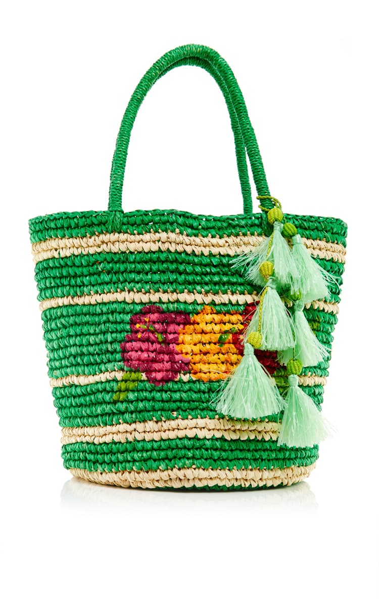 Canasto tejido y con pompones de Sensi Studio.