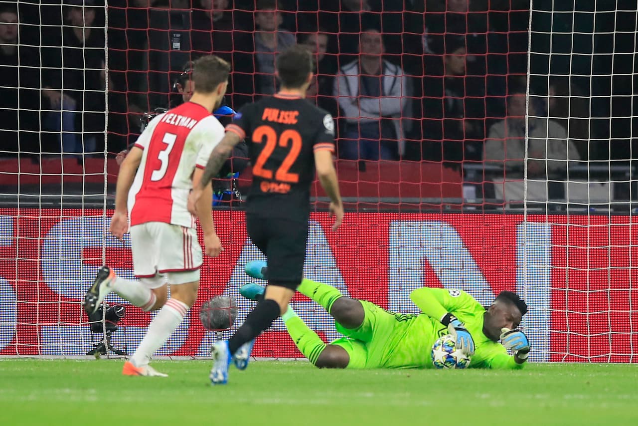 Chelsea's Christian Pulisic, center, has a shot blocked by Ajax's goalkeeper Andre Onana during the group H Champions League soccer match between Ajax and Chelsea at the Johan Cruyff ArenA in Amsterdam, Netherlands, Wednesday, Oct. 23, 2019. (AP Photo/Peter Dejong)