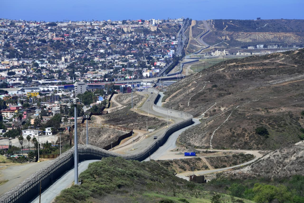 US Customs and Border Protection agents in their vehicle patrol from within the Border Infrastructure System, a no man's land area between the wall and fence which runs for 14 miles inland from the Pacific Ocean seperating California from Mexico on April 17, 2018 in San Diego, California across from Tijuana, Mexico, a day after California rejected plans by the federal government for National Guard troops on the border. / AFP PHOTO / FREDERIC J. BROWN (Photo credit should read FREDERIC J. BROWN/AFP/Getty Images)