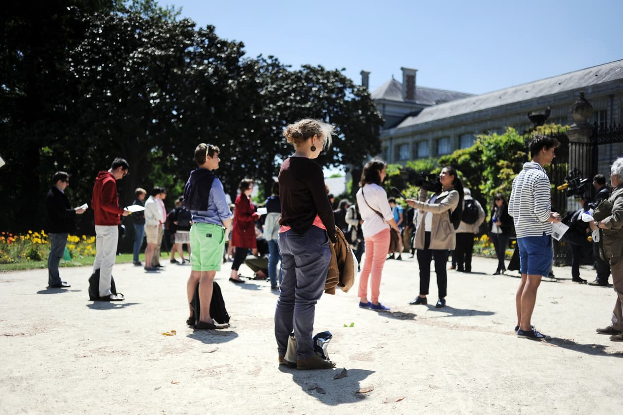 Members of the movement "sentinels" pray and face students who take part to the so called 'Ce que souleve la jupe' ("What raises the skirt?") event in high schools on May 16, 2014, in front of the Clemenceau high school in Nantes, western France. For the "What raises the skirt" event, the academic administration responsable for high schools in the Nantes' region invited "girls, boys, highschool students and staff to go to school on May 16, 2014 wearing a skirt or a pin reading 'I fight sexism, what about you?' to fight against all forms of sexism". Members of the "Manif pour tous" movement protest against what they call "gender theory", which they claim denies sexual differences. AFP PHOTO / JEAN-SEBASTIEN EVRARD (Photo credit should read JEAN-SEBASTIEN EVRARD/AFP/Getty Images)