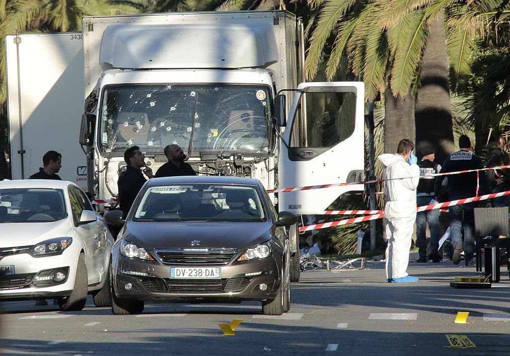 NICE, FRANCE - JULY 15: Forensic police investigate a truck at the scene of a terror attack on the Promenade des Anglais on July 15, 2016 in Nice, France. A French-Tunisian attacker killed 84 people as he drove a truck through crowds, gathered to watch a firework display during Bastille Day celebrations. The attacker then opened fire on people in the crowd before being shot dead by police. (Photo by Patrick Aventurier/Getty Images)