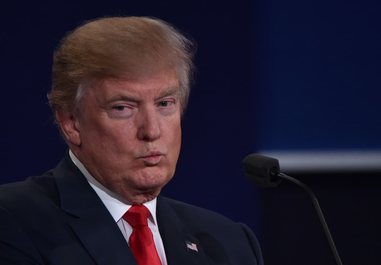Republican presidential nominee Donald Trump listens during the third and final US presidential debate with Democratic nominee Hillary Clinton at the Thomas & Mack Center on the campus of the University of Las Vegas in Las Vegas, Nevada on October 19, 2016. / AFP / Paul J. Richards (Photo credit should read PAUL J. RICHARDS/AFP/Getty Images)