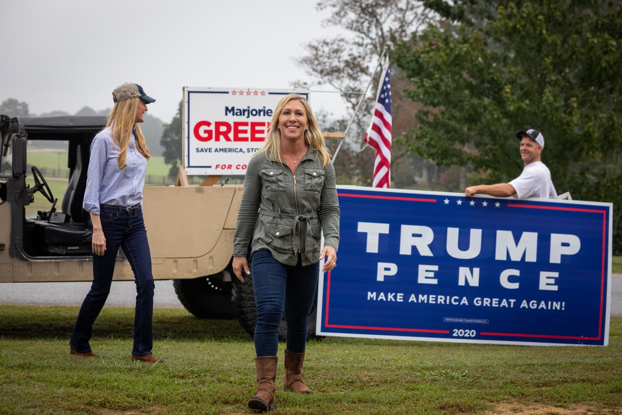DALLAS, GA - OCTOBER 15: Georgia Republican House candidate Marjorie Taylor Greene (C) and Sen. Kelly Loeffler (R-GA) (L) arrive at a press conference in a Humvee during which Greene endorsed Loeffler on October 15, 2020 in Dallas, Georgia. Greene has been the subject of some controversy recently due to her support for the right-wing conspiracy group QAnon. (Photo by Dustin Chambers/Getty Images)