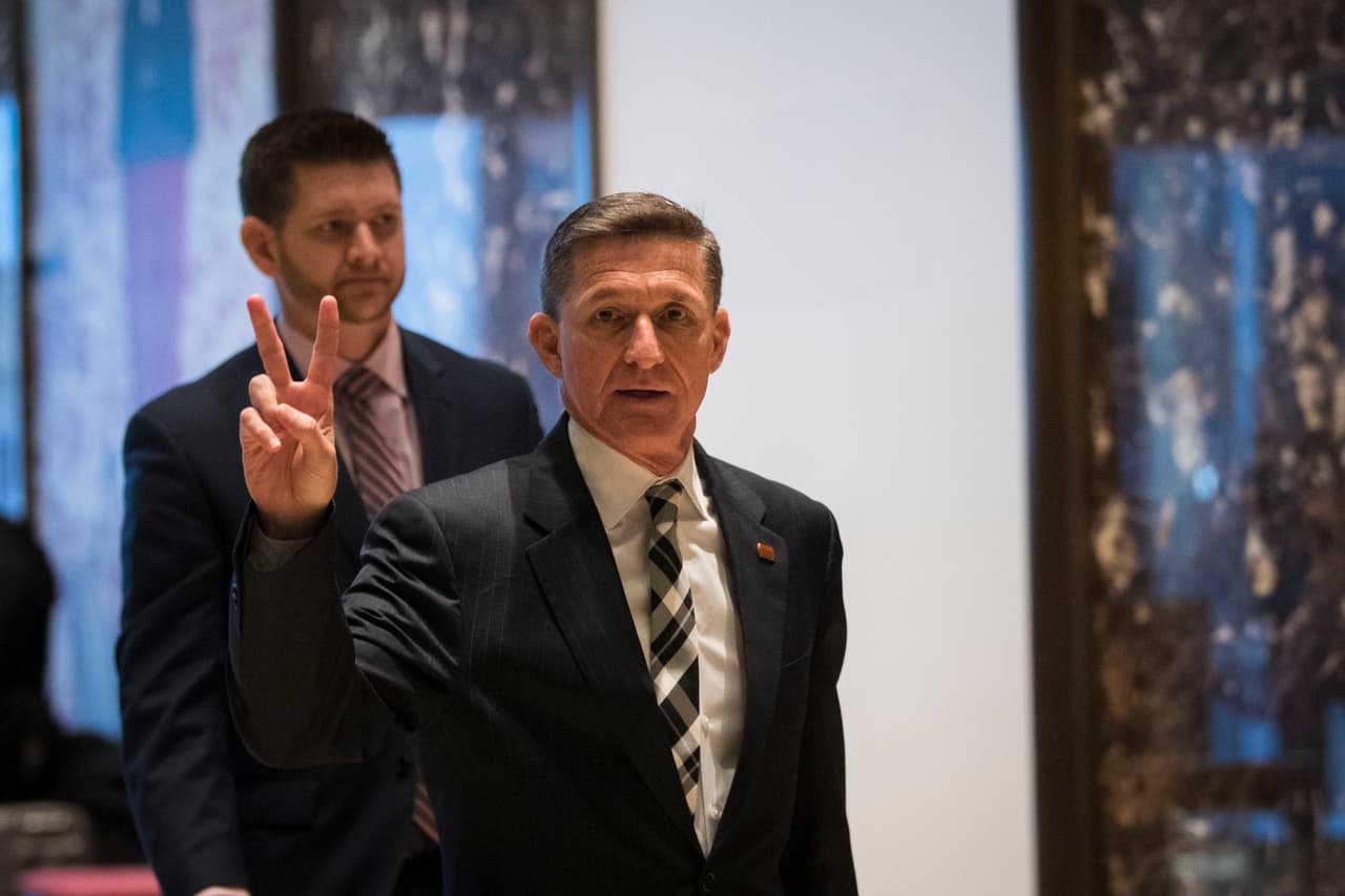 NEW YORK, NY - NOVEMBER 17: Retired Lt. Gen. Michael Flynn gestures as he arrives at Trump Tower, November 17, 2016 in New York City. President-elect Donald Trump and his transition team are in the process of filling cabinet and high level positions for the new administration. (Photo by Drew Angerer/Getty Images)