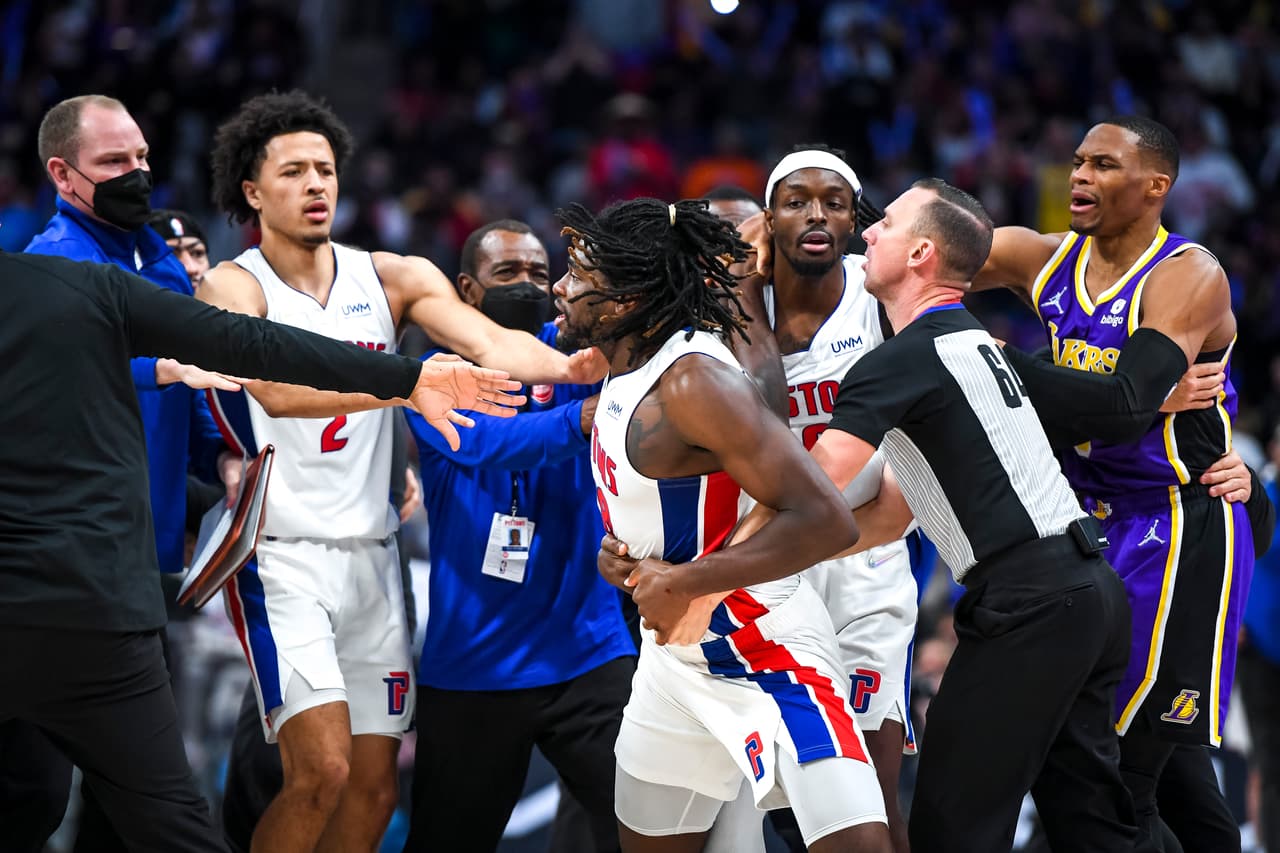 DETROIT, MICHIGAN - NOVEMBER 21: Isaiah Stewart #28 of the Detroit Pistons is restrained as he goes after LeBron James #6 of the Los Angeles Lakers during the third quarter of the game at Little Caesars Arena on November 21, 2021 in Detroit, Michigan. NOTE TO USER: User expressly acknowledges and agrees that, by downloading and or using this photograph, User is consenting to the terms and conditions of the Getty Images License Agreement. (Photo by Nic Antaya/Getty Images)
