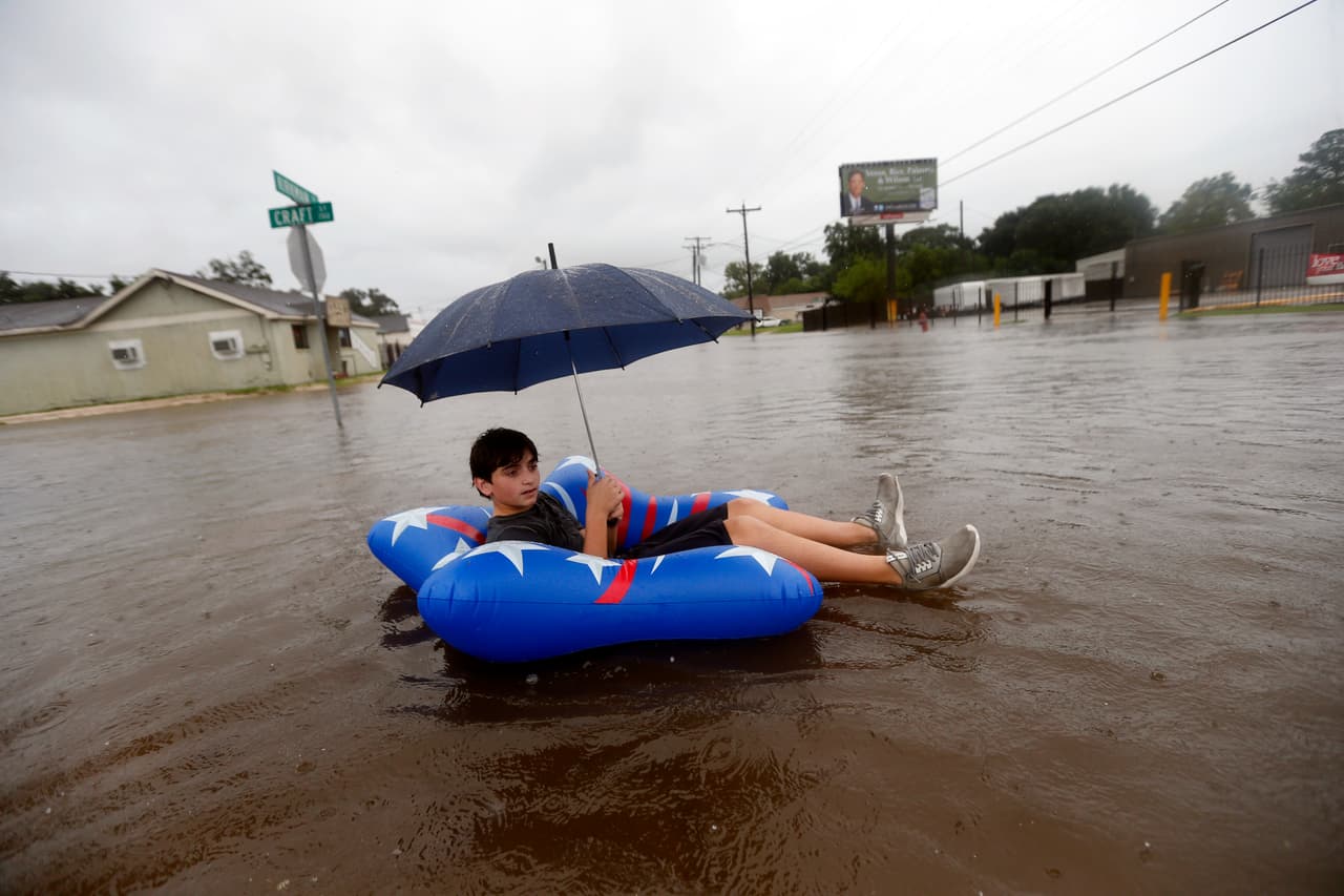 Julius Verret, 14, floats in Lake Charles, Texas.
<br>