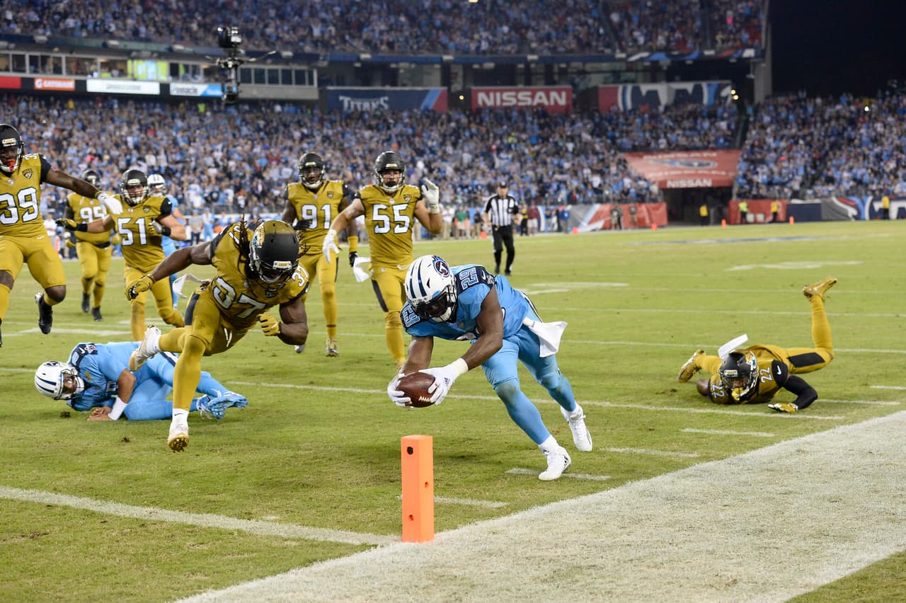 Tennessee Titans running back DeMarco Murray (29) beats Jacksonville Jaguars safety Johnathan Cyprien (37) to the end zone as Murray scores a touchdown on a 14-yard run in the first half of an NFL football game Thursday, Oct. 27, 2016, in Nashville, Tenn. (AP Photo/Mark Zaleski)