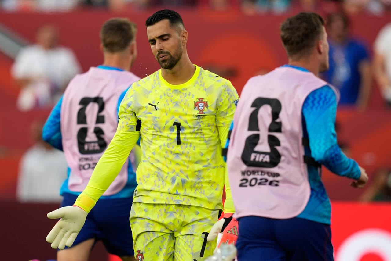 Portugal goalkeeper Diogo Costa (1) reacts as Croatia players rush past to celebrate after scoring the opening goal during the World Cup round of 32 soccer match between Portugal and Croatia in Toronto, Thursday, July 2, 2026. (AP Photo/Mike Stewart)