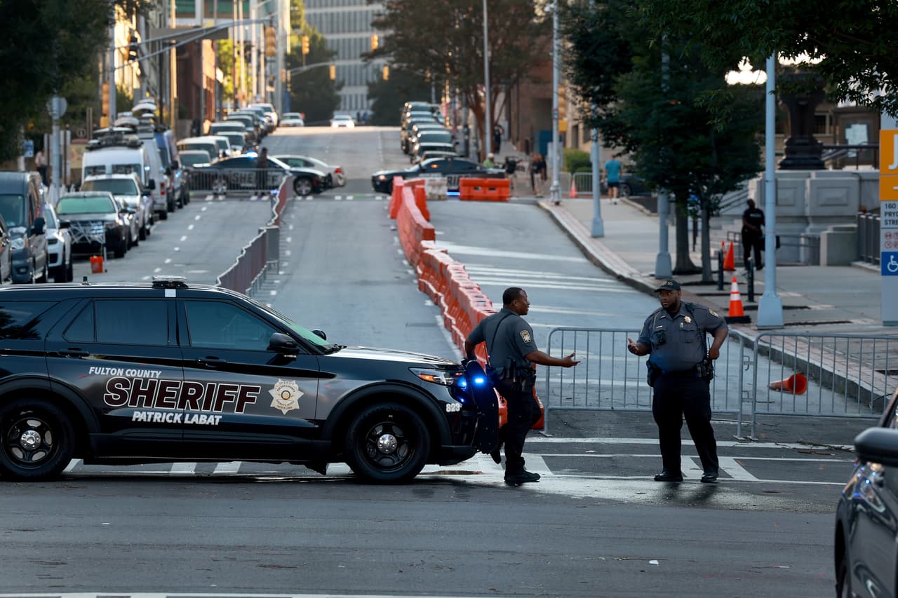 ATLANTA, GEORGIA - AUGUST 08: Fulton County Sheriff officers block off a street in front of the Fulton County Courthouse on August 07, 2023 in Atlanta, Georgia. The heightened security is in place as Fulton County District Attorney Fani Willis is expected to announce soon a possible grand jury indictment in her investigation into former President Donald Trump and his Republican allies' alleged attempt to overturn the 2020 election in the state. (Photo by Joe Raedle/Getty Images)