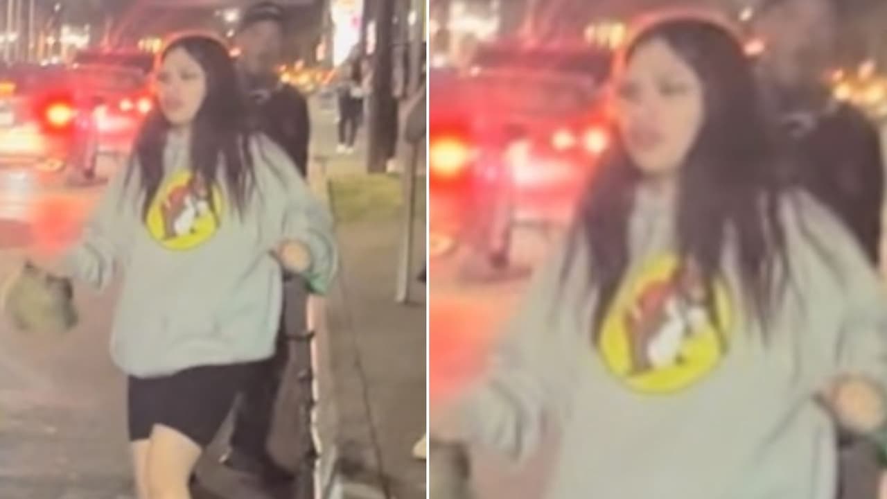 <b>Testigo del incidente:</b> Una segunda mujer, que llevaba una camisa de Buc-ee's y se presume que observó el altercado.