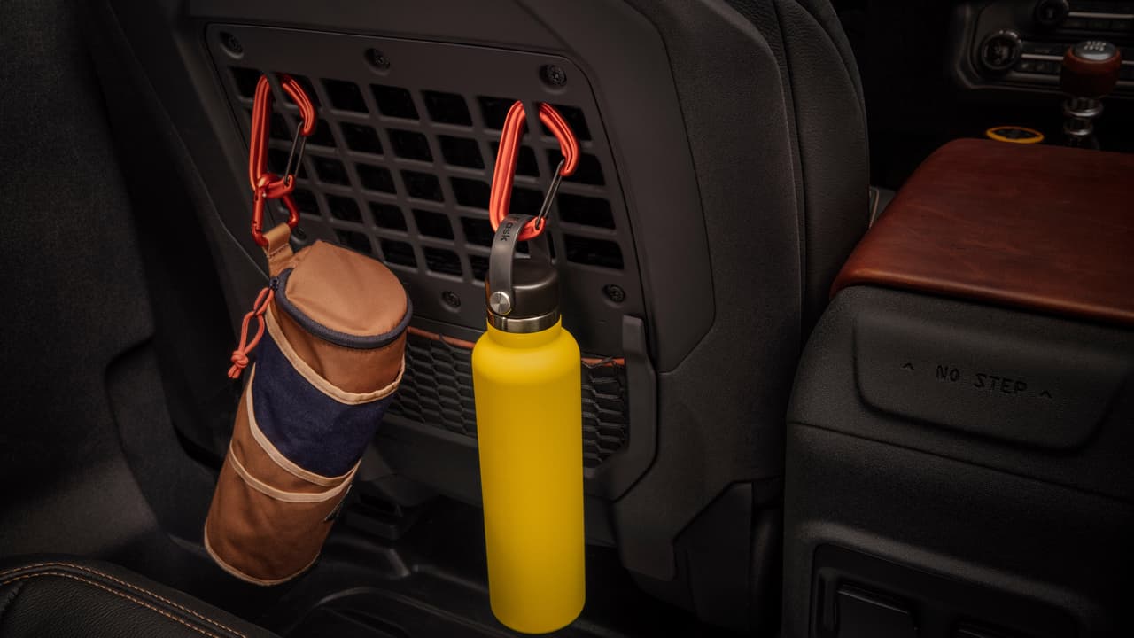 MOLLE hooks are mounted in the seatbacks for safe transport when the trails get rough in this prototype version of the all-new 2021 Bronco (not representative of production model). (Static display on private property with aftermarket accessories not available for sale.)