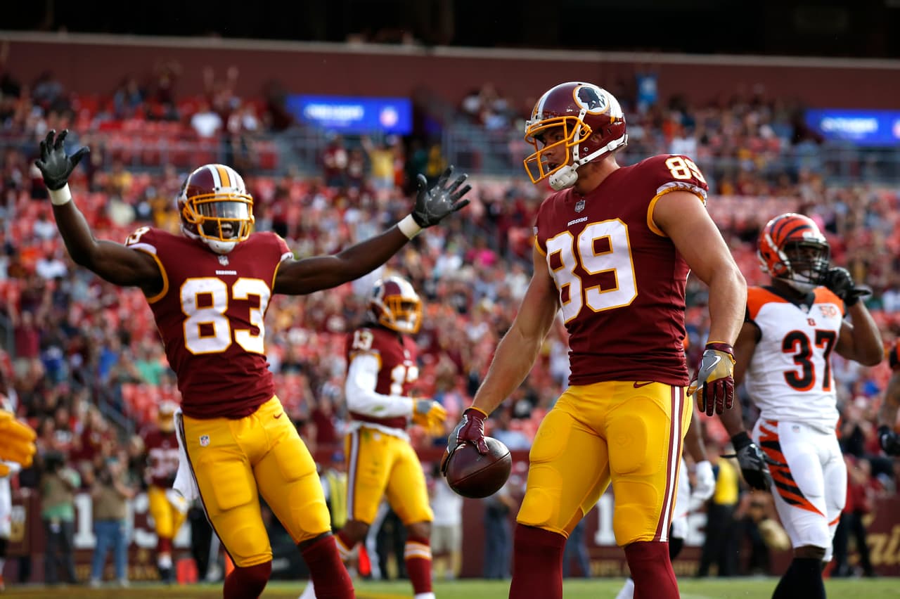Washington Redskins tight end Derek Carrier (89) celebrates his touchdown with teammates in the second half of a preseason NFL football game against the Cincinnati Bengals, Sunday, Aug. 27, 2017, in Landover, Md. (AP Photo/Alex Brandon)
