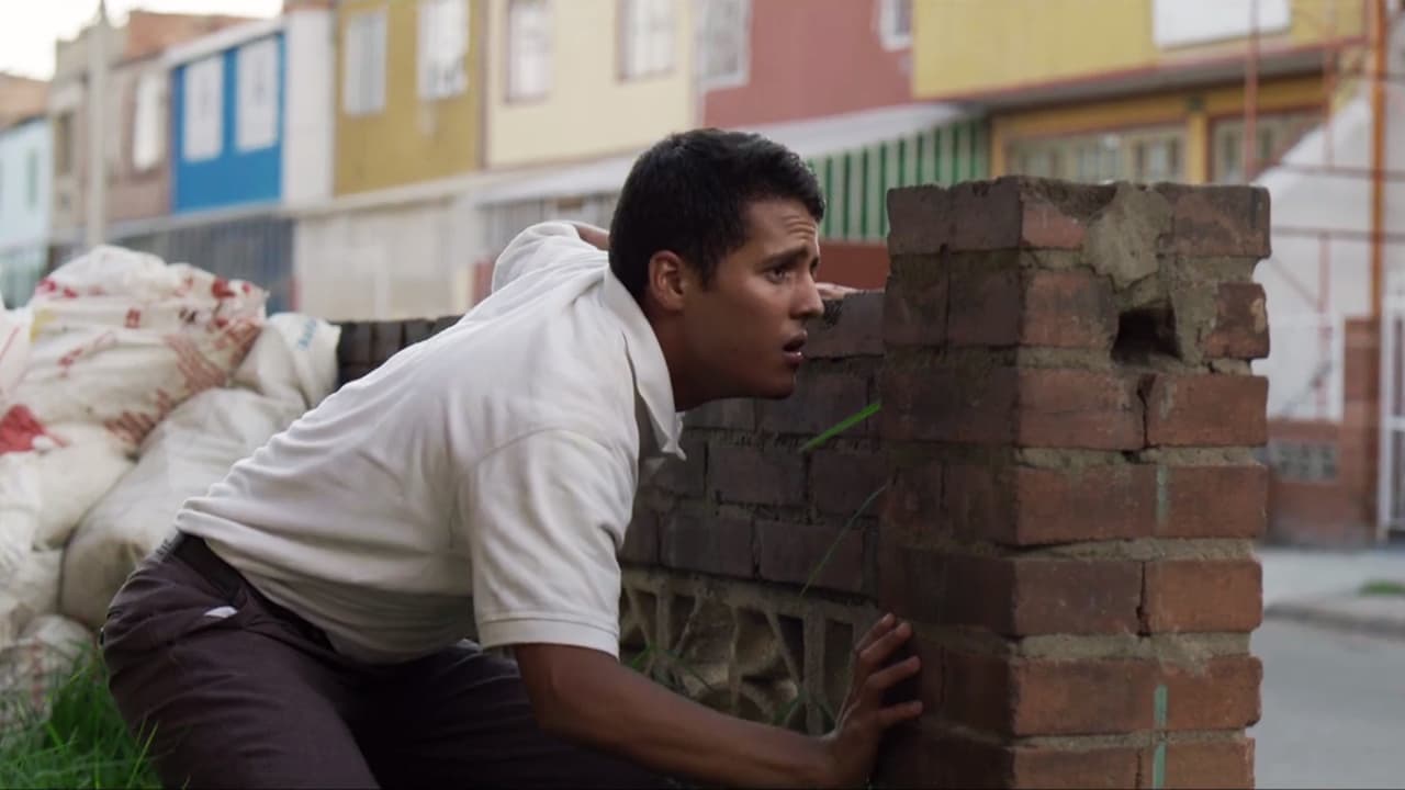 The student hid behind a low wall believing he had lost his pursuers.