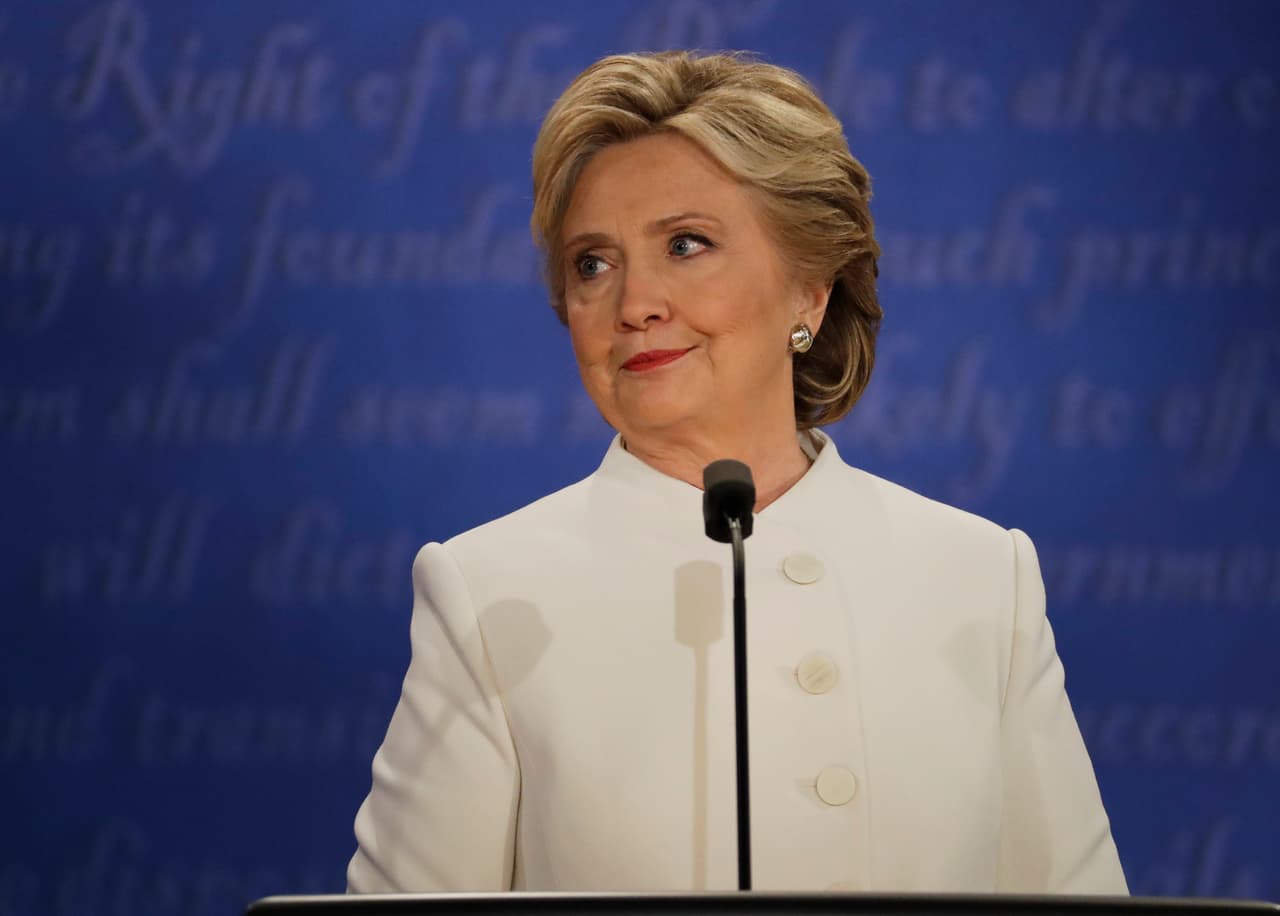 Democratic presidential nominee Hillary Clinton listens to Republican presidential nominee Donald Trump during the third presidential debate at UNLV in Las Vegas, Wednesday, Oct. 19, 2016. (AP Photo/Patrick Semansky)