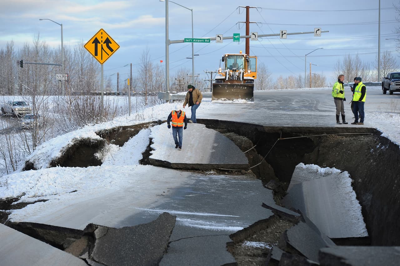 Workers inspect an off-ramp that collapsed during a morning earthquake, Friday, Nov. 30, 2018, in Anchorage, Alaska. (AP Photo/Mike Dinneen)