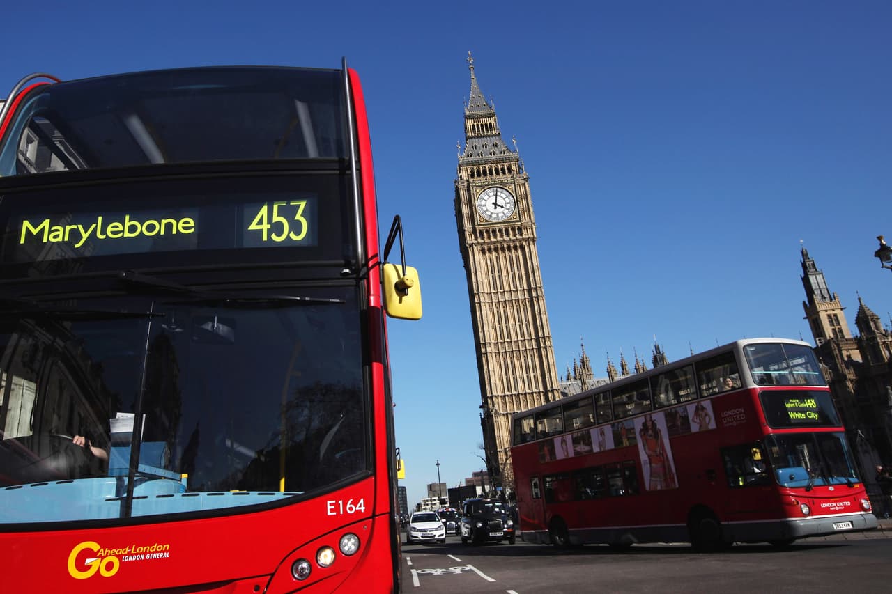 LONDON, ENGLAND - MARCH 27: Double decker buses make their way past Big Ben and the Houses of Parliament on March 27, 2012 in London, England. (Photo by Dan Kitwood/Getty Images)