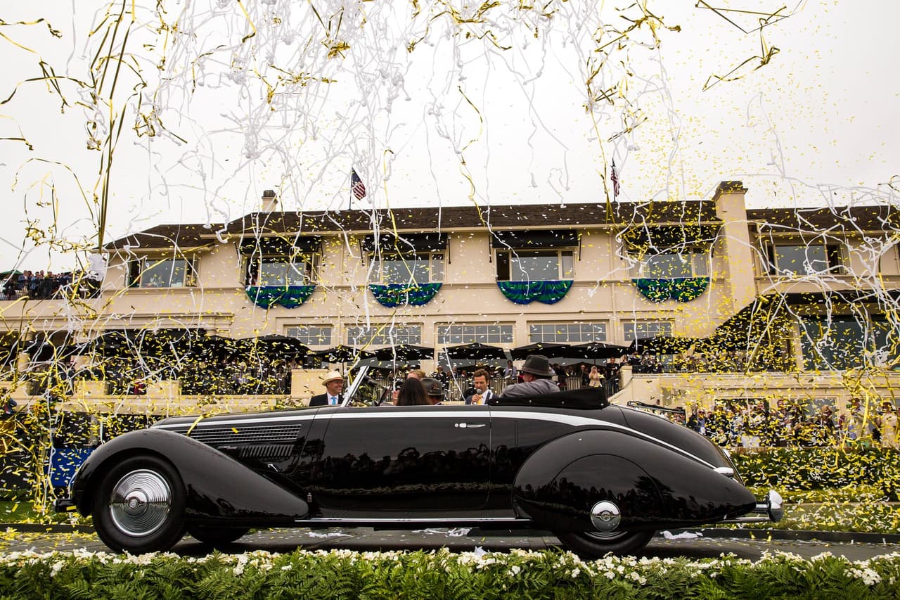 <b>Y el ganador es</b>: el 
<b>Lancia Astura Pinin Farina Cabroilet</b> de 
<b>1936</b>. El actual dueño de este auto es 
<b>Richard Mattei</b> quien con esta victoria hizo su debut triunfal en 
<b>Pebble Beach</b>. Este auto, que perteneció a 
<b>Eric Clapton</b>, estuvo en la colección de 
<b>Pininfarina</b> hasta 2009 cuando fue adquirido por Mattei quien emprendió una restauración completa inmediatamente.