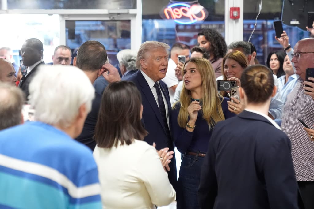 President Donald Trump speaks as he visits Venezuelan restaurant El Arepazo, Monday, March 9, 2026, in Doral, Fla. (AP Photo/Mark Schiefelbein)