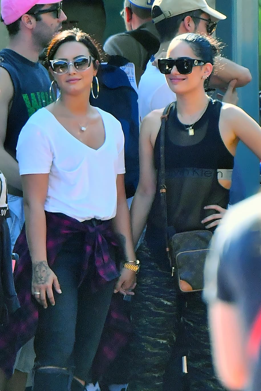 Photo © 2017 Mega/The Grosby Group EXCLUSIVE Los Angeles, CA September 11, 2017 Demi Lovato holds hands with a mystery woman while spending a happy day a Disneyland gets photobombed by Donald Duck. Demi and her new lady walked hand in hand all day Long as they enjoyed a day. they were seen riding the California screaming rollercoaster. Demi looked extremely happy.