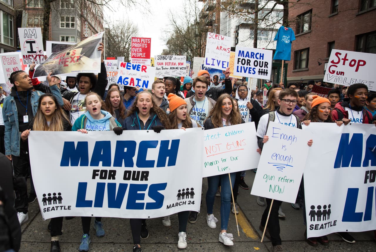 SEATTLE, WA - MARCH 24: Students lead the march down Pine Street during the March for Our Lives rally on March 24, 2018 in Seattle, Washington. More than 800 March for Our Lives events, organized by survivors of the Parkland, Florida school shooting on February 14 that left 17 dead, are taking place around the world to call for legislative action to address school safety and gun violence. (Photo by Lindsey Wasson/Getty Images)
