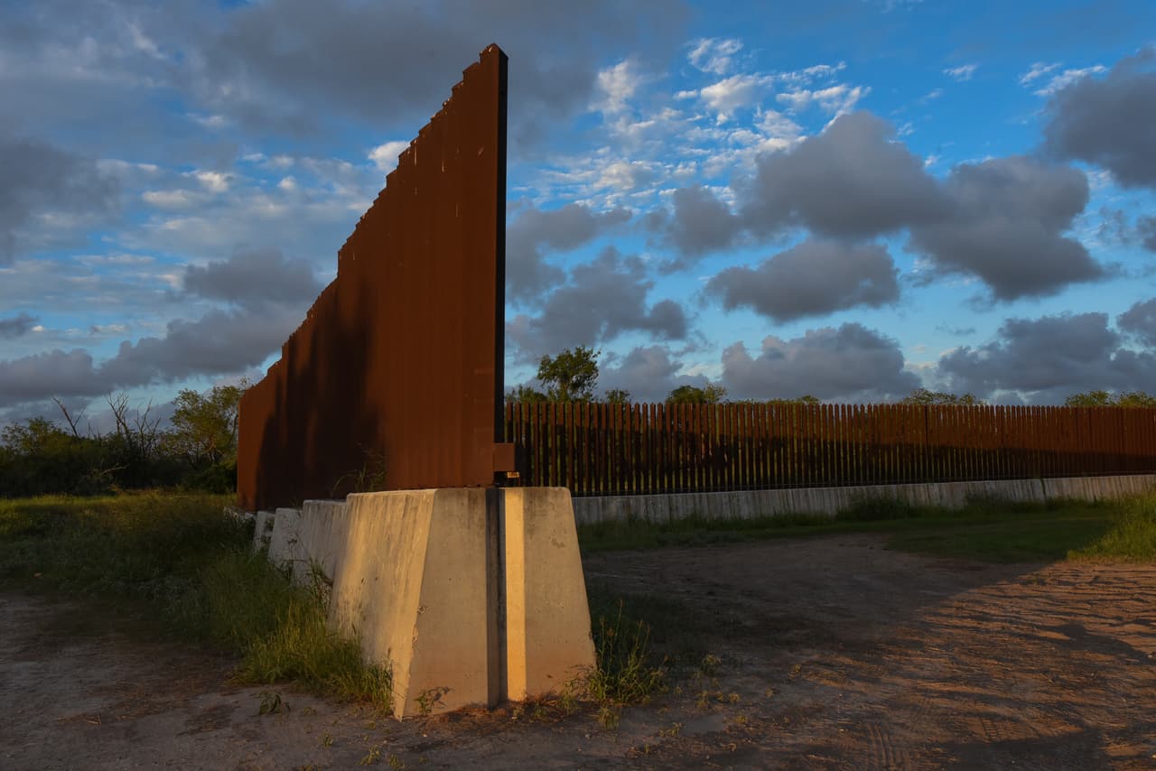 Dusk begins to fall at a section of border fence in Brownsville, Texas, on Wednesday, Nov. 8, 2023. The Biden administration's plan to build new barriers along the U.S.-Mexico border calls for a "movable" design that frustrates both environmentalists and advocates of stronger border enforcement. (AP Photo/Valerie Gonzalez)