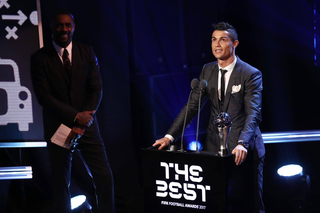 LONDON, ENGLAND - OCTOBER 23: Cristiano Ronaldo of Portugal and Real Madrid CF wins The best Fifa men's player as Idris Elba looks on during The Best FIFA Football Awards Show on October 23, 2017 in London, England. (Photo by Bryn Lennon/Getty Images)