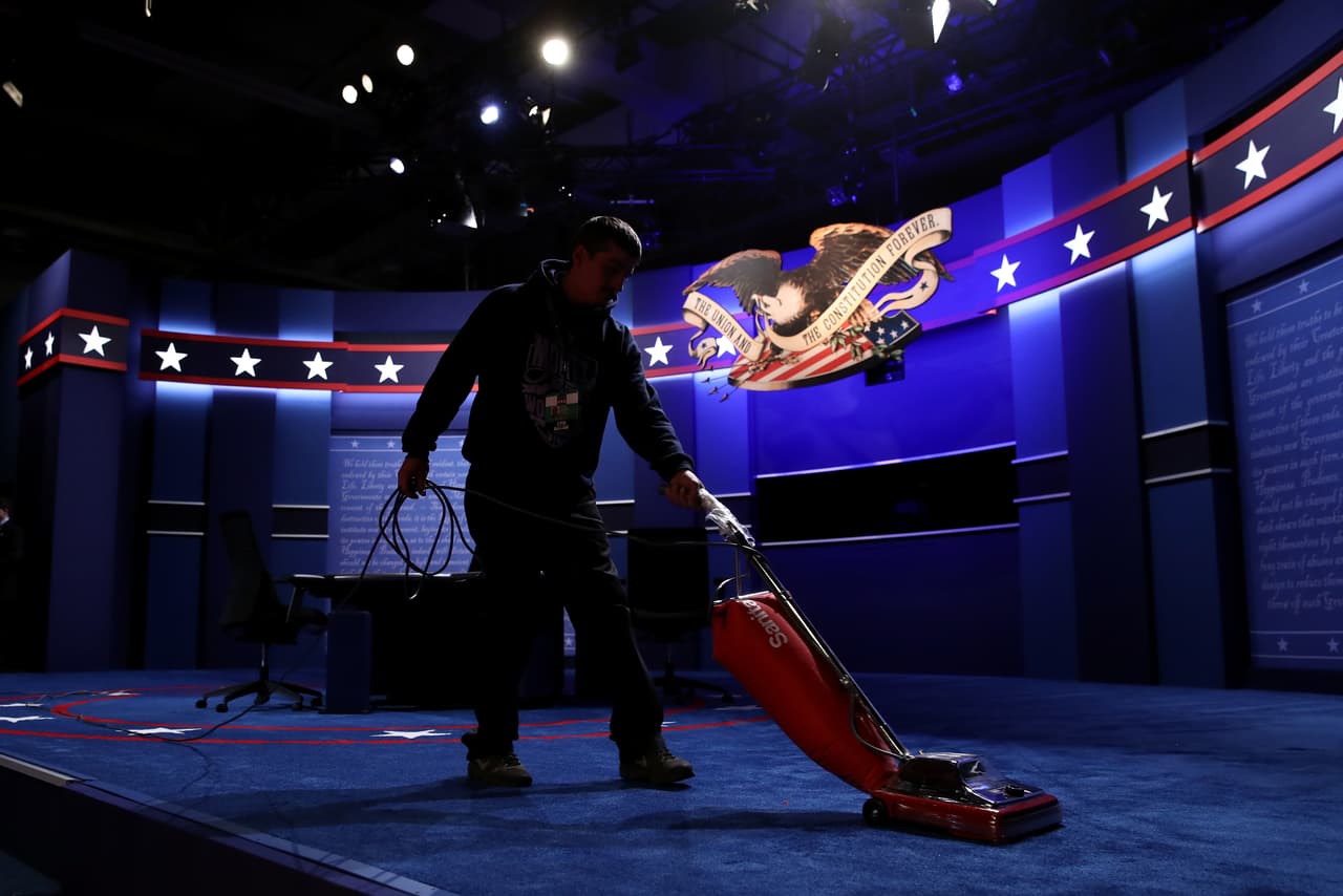 FARMVILLE, VA - OCTOBER 04: A worker vacuums prior to the Vice Presidential Debate between Democratic vice presidential nominee Tim Kaine and Republican vice presidential nominee Mike Pence at Longwood University on October 4, 2016 in Farmville, Virginia. This is the second of four debates during the presidential election season and the only debate between the vice presidential candidates. (Photo by Win McNamee/Getty Images)