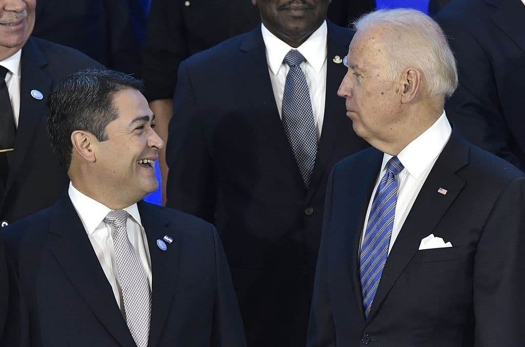 US Vice President Joe Biden (R) chats with Honduras President Juan Orlando Hernandez while posing for a group photo during the US, Caribbean, Central American Energy Summit in Washington, DC on May 4, 2016.