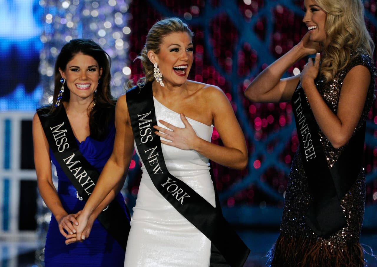 LAS VEGAS, NV - JANUARY 12: Joanna Guy (L), Miss Maryland, and Chandler Lawson (R), Miss Tennessee, congratulate Mallory Hytes Hagan, Miss New York, as she reacts during the 2013 Miss America Pageant at PH Live at Planet Hollywood Resort & Casino on January 12, 2013 in Las Vegas, Nevada. (Photo by David Becker/Getty Images)