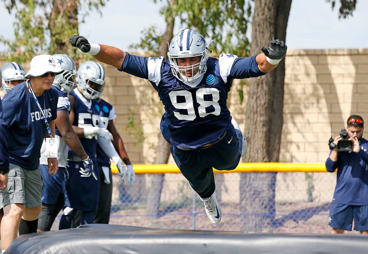 Dallas Cowboys defensive end Tyrone Crawford (98) runs drills during the Cowboys first day of NFL training camp, Monday, July 24, 2017 in Oxnard, California. (James D Smith via AP)