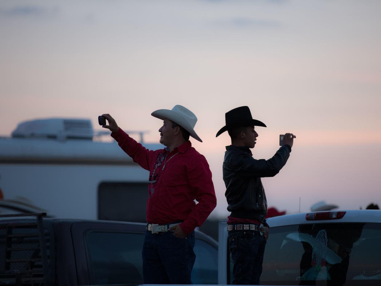 Two of Rubi's guests capture the party on their phones