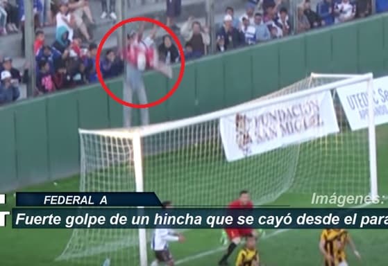 Aficionado cae de alambrado durante un partido de fútbol y bromea con policía 