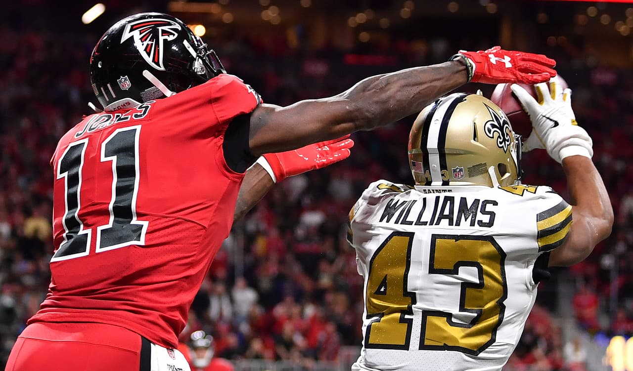 New Orleans Saints free safety Marcus Williams (43) picks off the ball against Atlanta Falcons wide receiver Julio Jones (11) during the second half of an NFL football game, Thursday, Dec. 7, 2017, in Atlanta. (AP Photo/Danny Karnik)