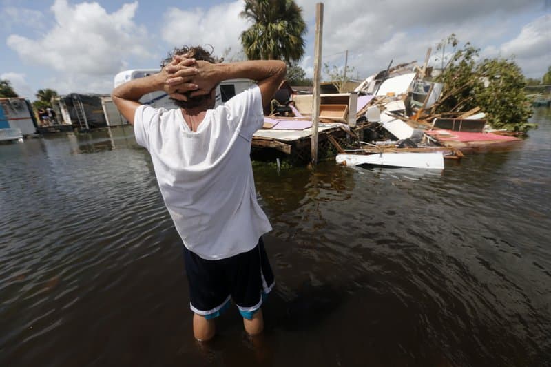 Larry Dimas walk around his destroyed trailer in Immokalee, Fla. Irma badly damaged Dimas’ mobile home and destroyed another he used for rental income, making his tough life even harder. (AP Photo/Gerald Herbert)