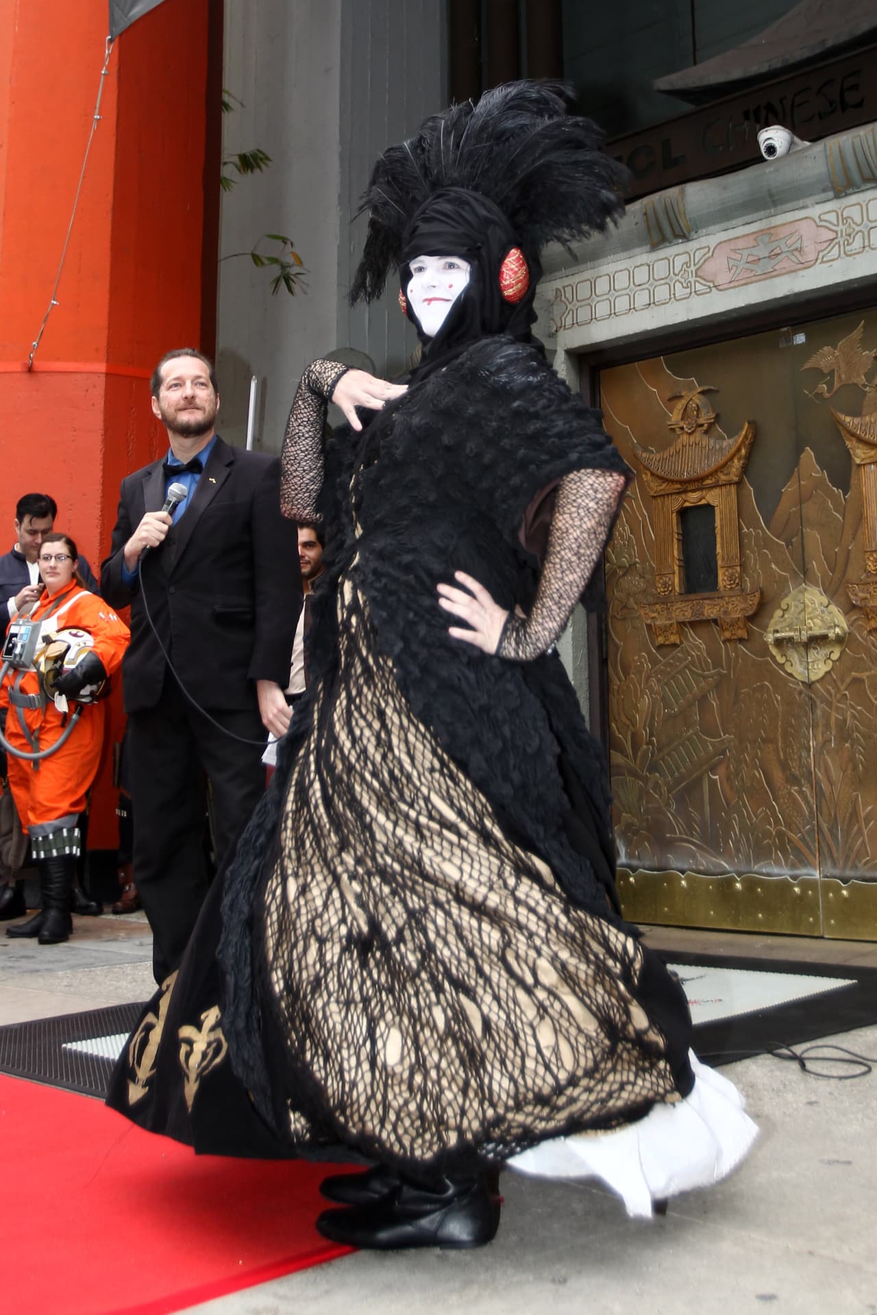 Fans pose for judges during the costume contest of Star Wars fans lining up to see Rogue One: A Star Wars Story at the TCL Chinese Theatre in Hollywood, California, on December 15, 2016. / AFP / TOMMASO BODDI (Photo credit should read TOMMASO BODDI/AFP/Getty Images)