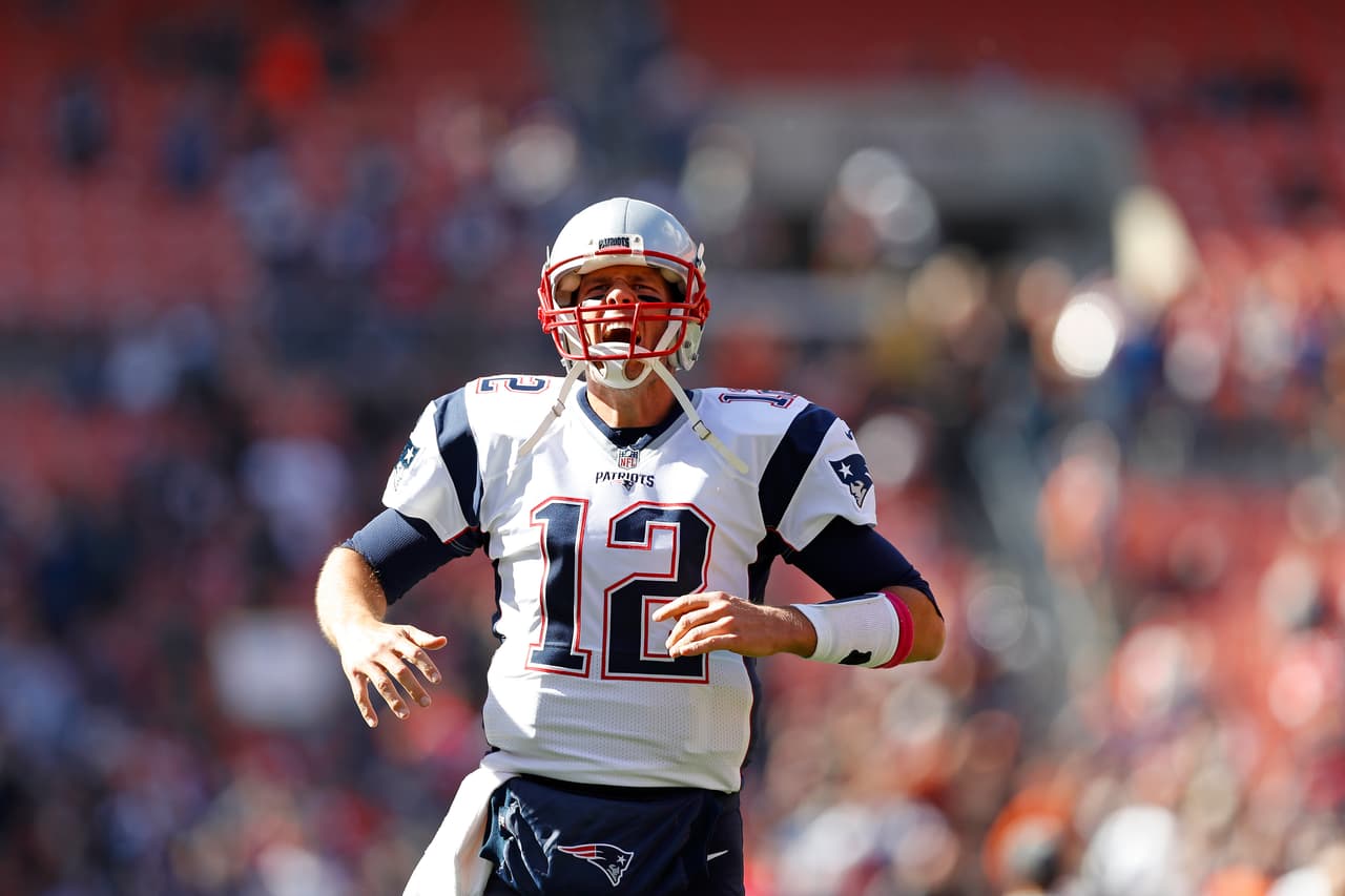 New England Patriots quarterback Tom Brady (12) yells as he makes his way onto the field prior to an NFL football game against the Cleveland Browns on Sunday, Oct. 9, 2016 in Cleveland. (Aaron M. Sprecher via AP)