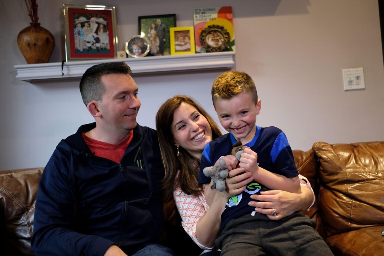 Seven-year-old transgender boy Jacob Lemay poses with his parents Joe and Mimi at their home in Melrose, Massachusetts, on May 9, 2017. For months in the Lemay home, the same phrase was repeated over and over by their troubled young child, barely more than a toddler, who showed growing signs of depression. "It is a mistake, I am not a girl, I am a boy." That convinced the Lemay family that Mia should become Jacob. / AFP PHOTO / JEWEL SAMAD / TO GO WITH AFP STORY by Catherine TRIOMPHE, US-society-children-gender (Photo credit should read JEWEL SAMAD/AFP/Getty Images)