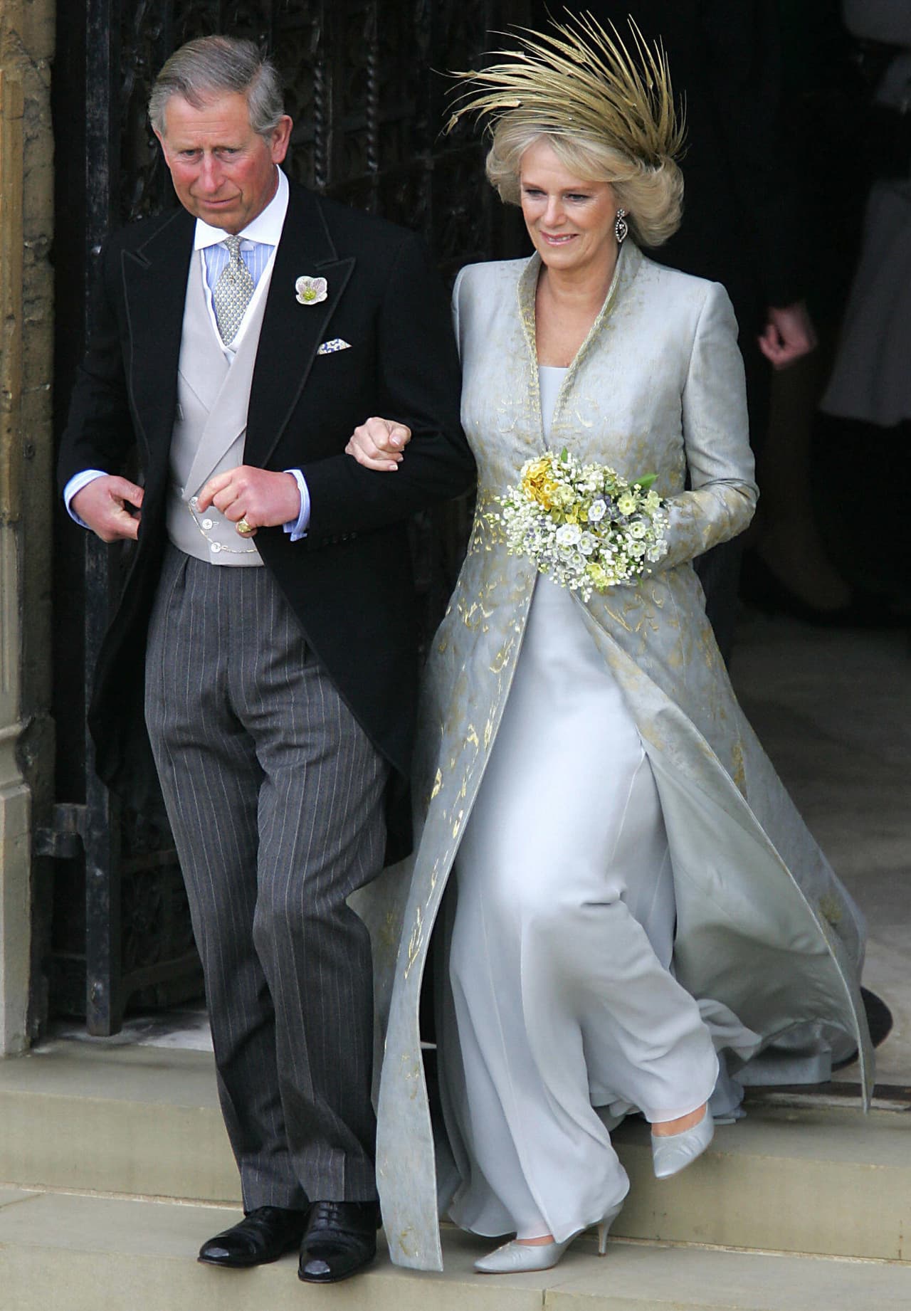 <b>2005 - Camilla Parker Bowles and Charles of Wales</b>
<br>At this 
<a href="http://www.abc.es/20110409/archivo/abci-boda-principe-carlos-camila-201104081915.html">'no kiss'</a>, wedding, the bride eschewed white. Over a light blue gown, she wore a damask brocade coat by Robinson Valentine. Instead of a crown, she wore a showy headpiece of golden feathers by Philip Treacy.