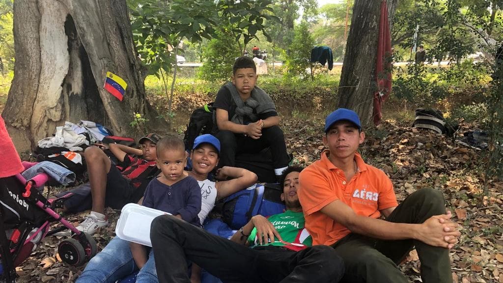 William, 24, (c, with green t-shirt) arrived at the camp with his wife, his one and a half year old son and some friends. "We are here to change our lives," he said. "(In Venezuela) there is extreme poverty, a lot of evil. They are big millionaires (Maduro's government) are we are poorer than ever," added his friend Luis (r). They said they will return when "the government falls, when Guaidó is in command."