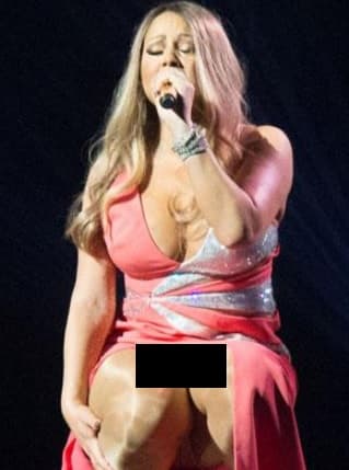 ¿De qué color usa los calzones Mariah Carey? ¡Dorados y con brillos! La cantante se agachó y los enseñó.