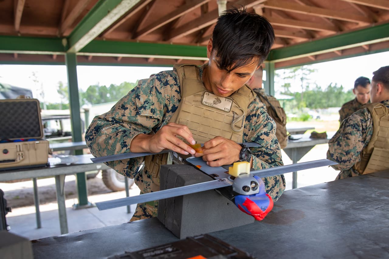 The Switchblade 300 model weighs about two kilograms, flies for up to 15 minutes at a time and is designed to be carried in a backpack, according to AeroVironment, the US manufacturer. Pictured: A US Marine prepares a Switchblade Drone for launch during a training exercise at Camp Lejeune, North Carolina, on 7 July 2021.