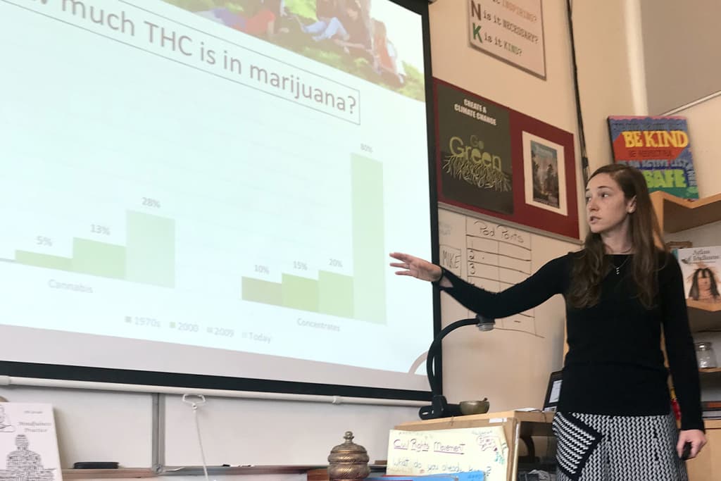 Ashley Brady explains the increase over time in marijuana potency to a class of eighth-graders at Marin Primary and Secondary School in Larkspur, California. (Carrie Feibel/KQED)