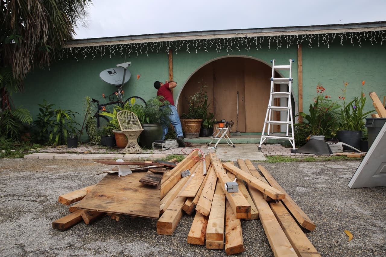 Maximiliano Garciga, a Cuban American was busy Saturday making last minute preparations to protect his home in Golden Gate, a largely Hispanic barrio in Naples.