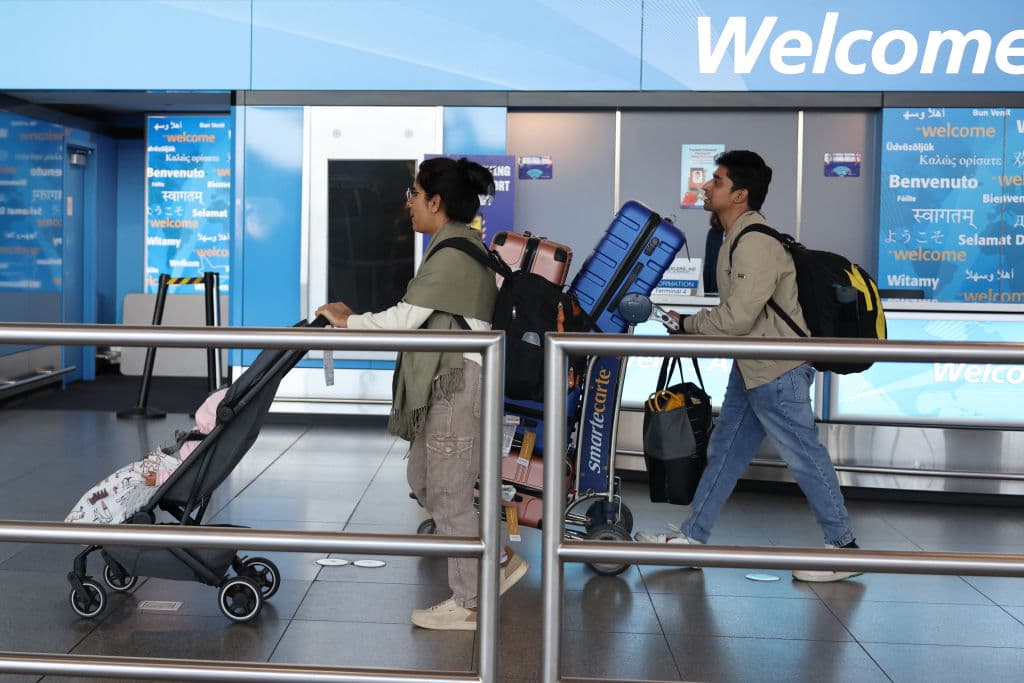 NEW YORK, NEW YORK - NOVEMBER 27: People arrive for the Thanksgiving holiday at John F. Kennedy Airport on November 27, 2024 in New York, New York. The Transportation Security Administration announced that they are prepared for the busiest Thanksgiving travel period on record and are projected to screen 18.3 million people from Tuesday, Nov. 26 to Monday, Dec. 2. (Photo by Michael M. Santiago/Getty Images)