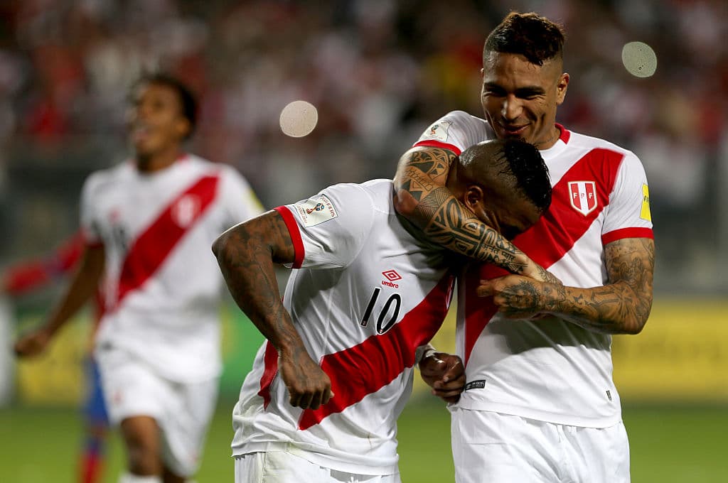 LIMA, PERU - OCTOBER 13: Jefferson Farfan of Peru celebrates with teammate Paolo Guerrero after scoring the second goal of his team against Chile during a match between Peru and Chile as part of FIFA 2018 World Cup Qualifier at Nacional Stadium on October 13, 2015 in Lima, Peru. (Photo by Raul Sifuentes/LatinContent/Getty Images)