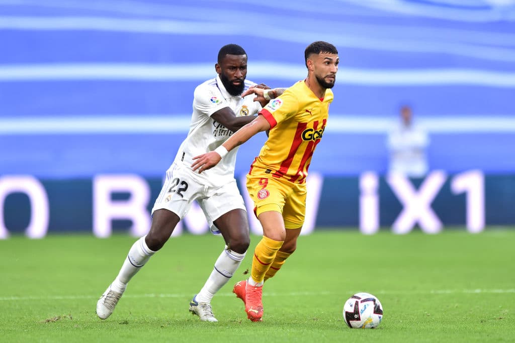 MADRID, SPAIN - OCTOBER 30: Valentin 'Taty' Castellanos of Girona FC is put under pressure by Antonio Rudiger of Real Madrid during the LaLiga Santander match between Real Madrid CF and Girona FC at Estadio Santiago Bernabeu on October 30, 2022 in Madrid, Spain. (Photo by Denis Doyle/Getty Images)